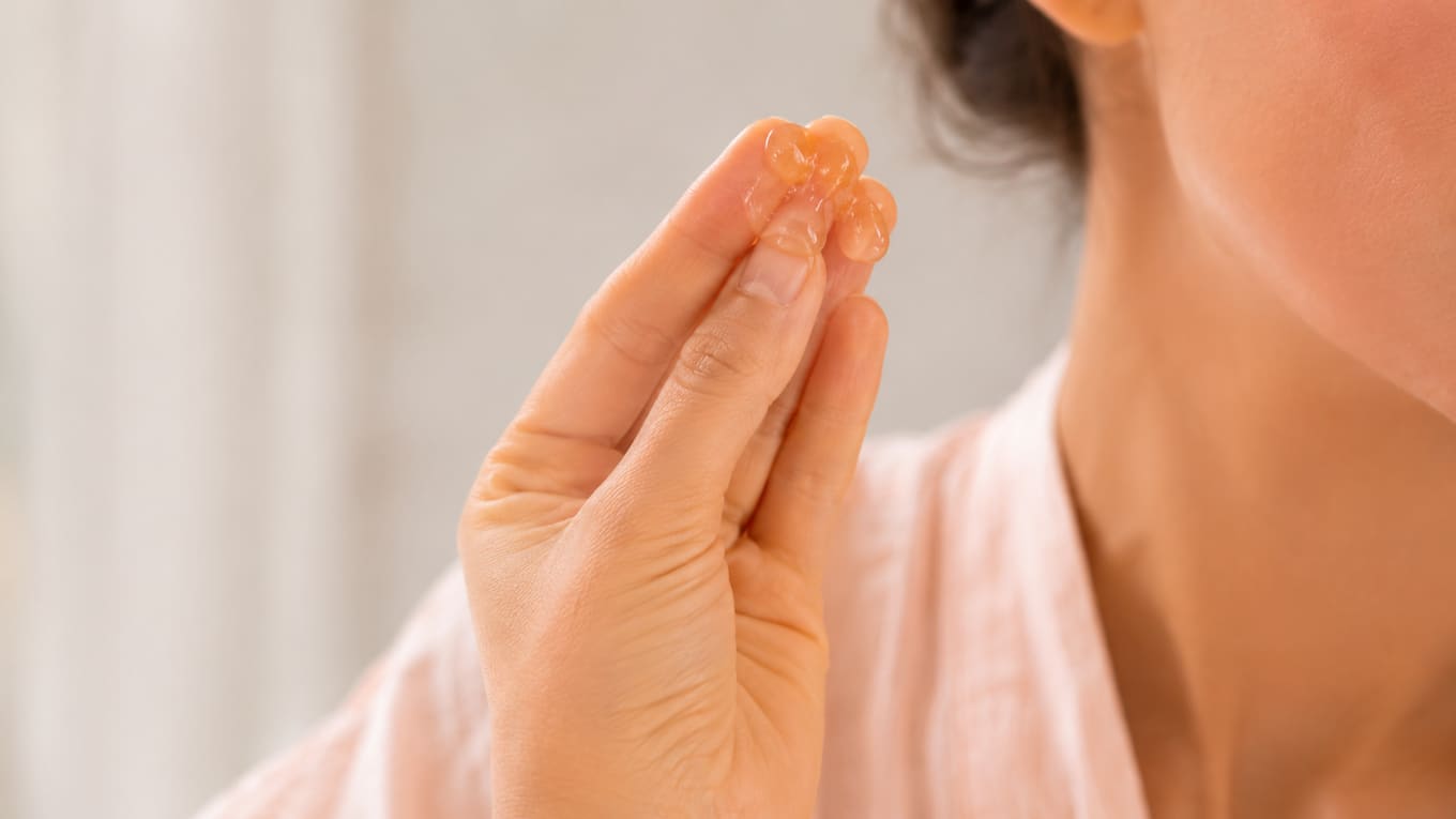 Warming two to three drops of pre-shave oil between the fingertips before applying